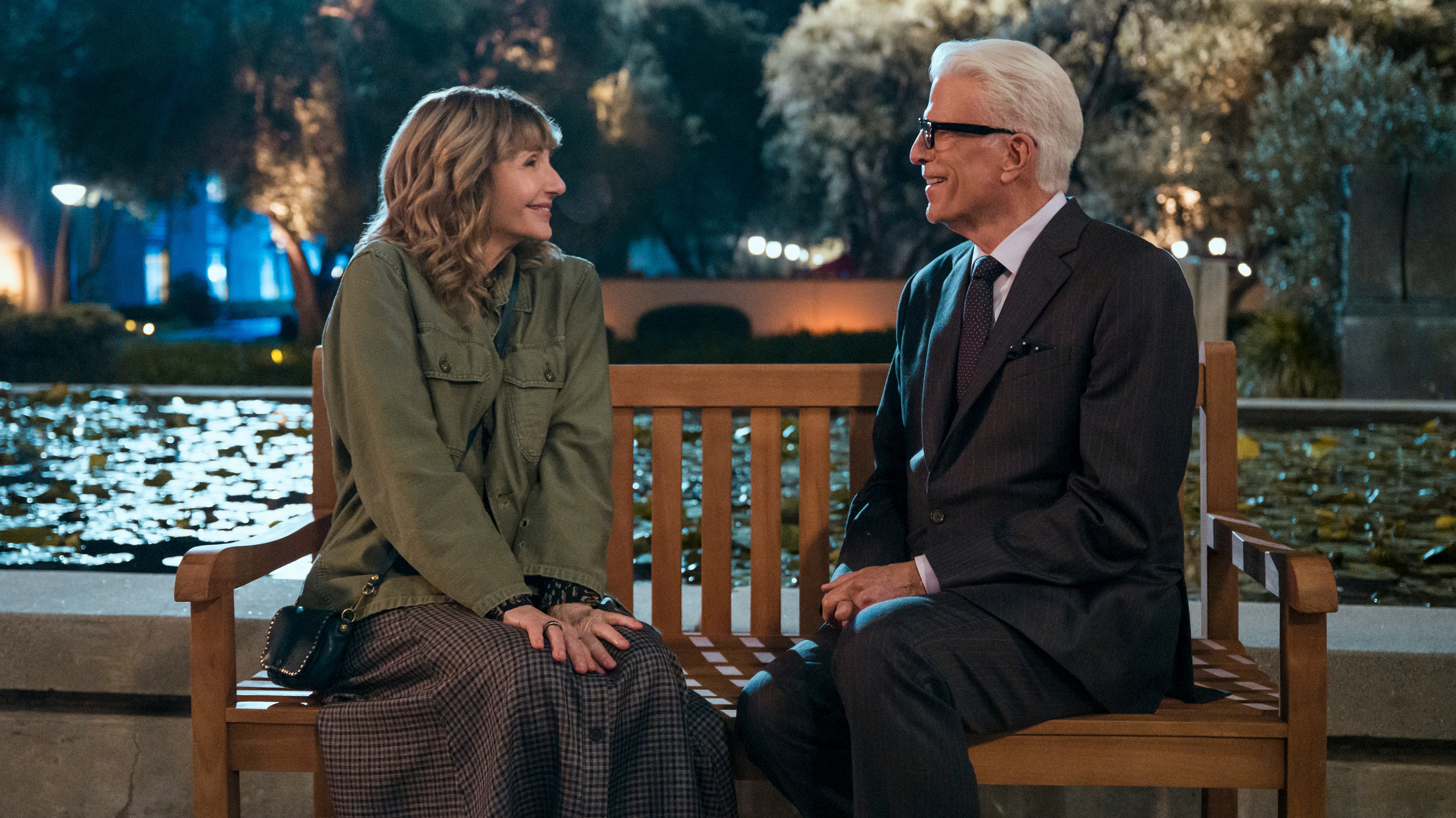 L-R: Mona (Mary Steenburgen) and Charles (Ted Danson) sit on a bench together in a scene from "A Man on the Inside" season 2