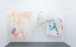 The exhibition's pieces were designed to reflect the banal daily experience of consumption, by repurposing materials such as tassels, beads, nets and organza sourced from old fruit and vegetable packaging