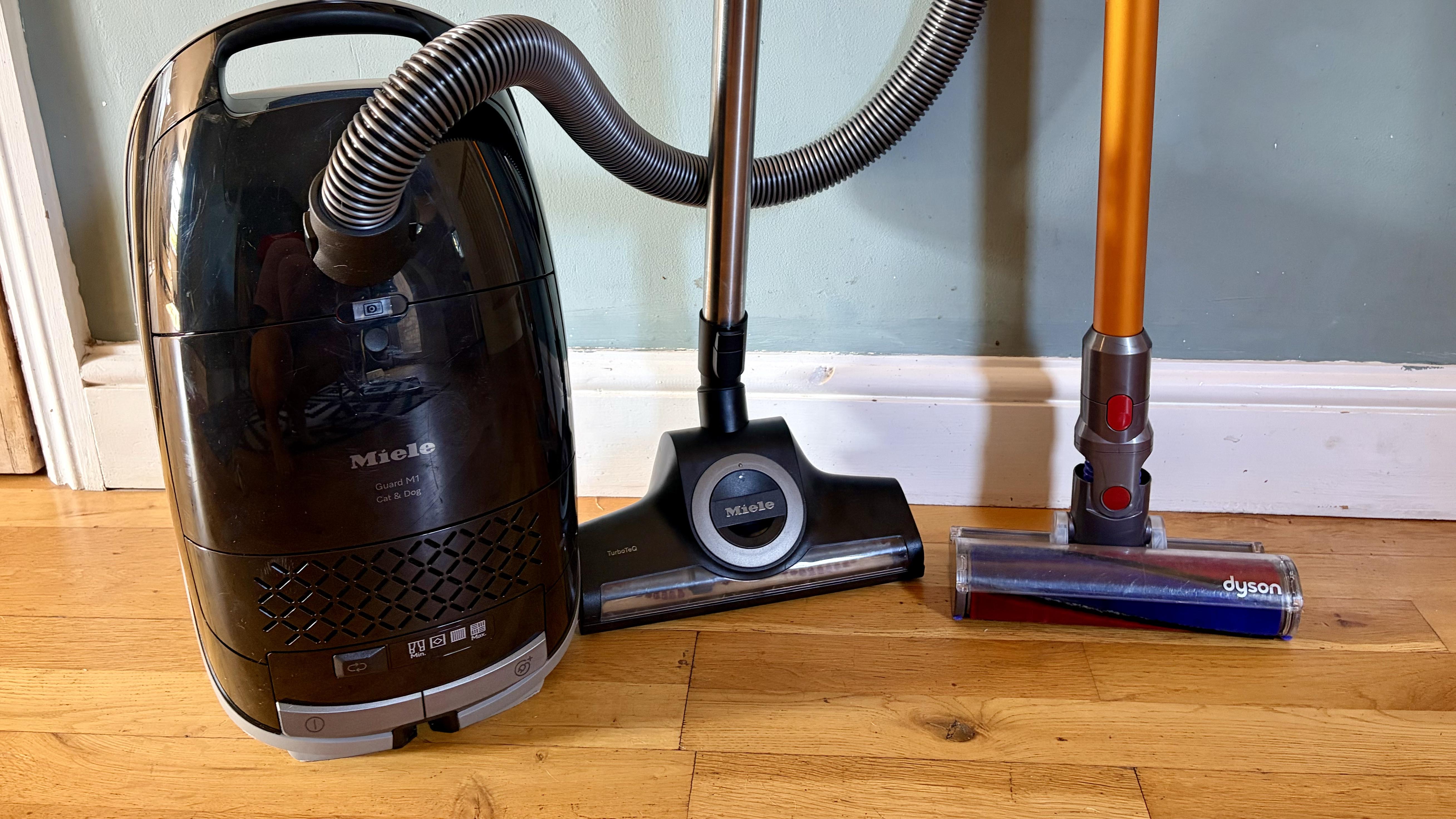 a photo of the Miele Guard M1 and Dyson v8