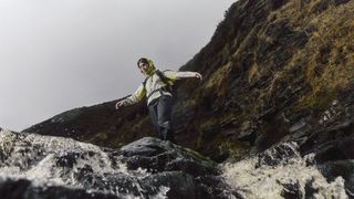Hiker in rainy weather wearing the Berghaus Pacsmart Pants