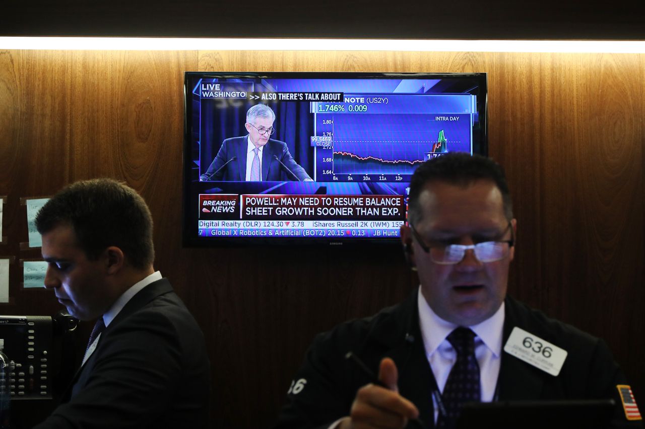 Jerome Powell on a TV screen