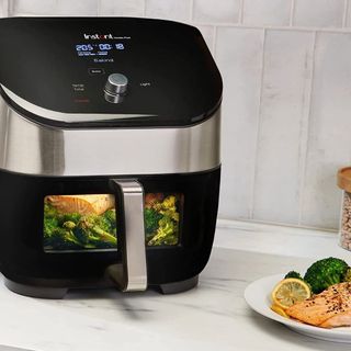 Instant Vortex Plus 6-in-1 Air Fryer with roast vegetables and salmon on a plate