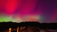 A photo of pink and green auroras