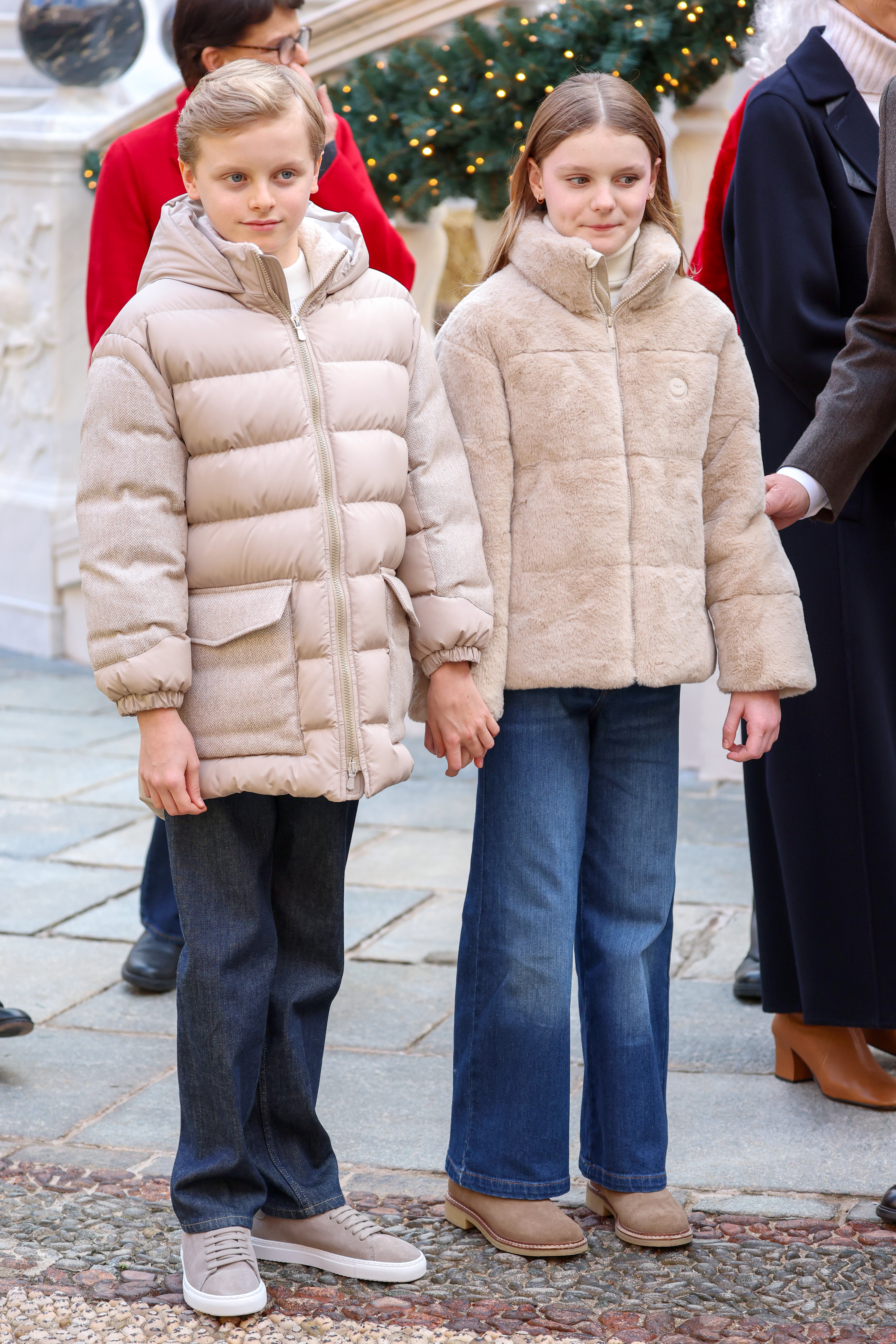 Princess Gabriella of Monaco and Prince Jacques of Monaco wearing tan coats and jeans