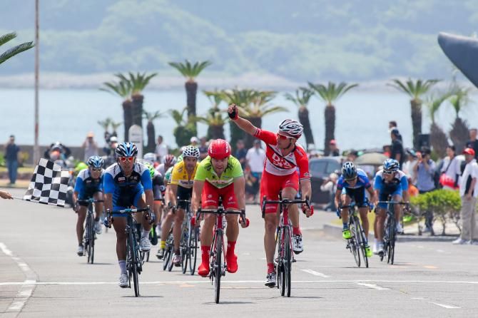 Will Clarke celebrates Drapac teammate Wouter Wippert's stage three victory