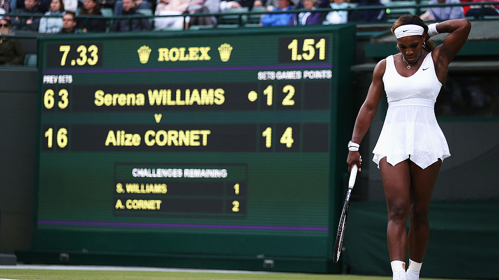 Serena Williams by a tennis scoreboard