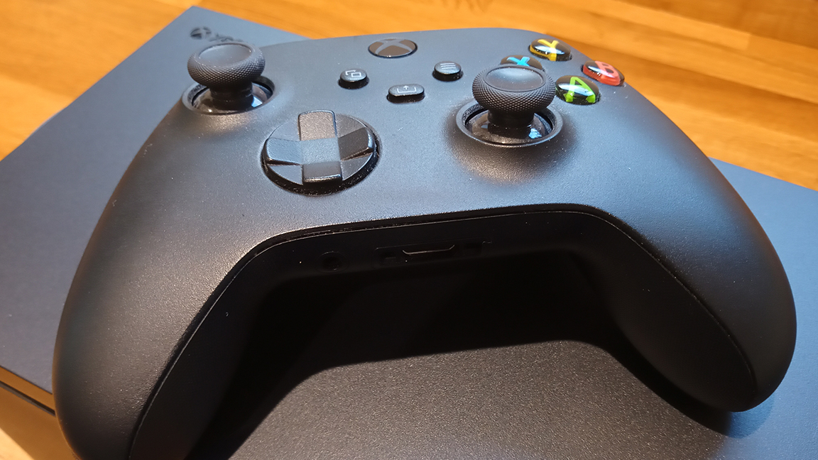 Xbox Series X review; an Xbox pad sits on top of an Xbox Series X games console