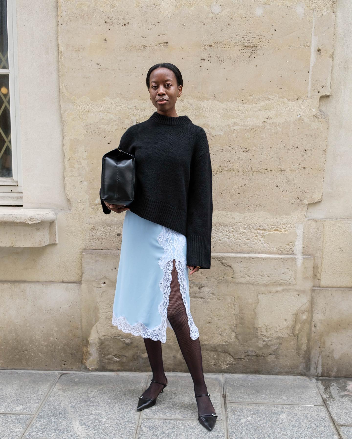 Influencer wears a lace trimmed skirt.