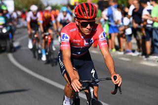 TOMARES SPAIN SEPTEMBER 06 Remco Evenepoel of Belgium and Team QuickStep Alpha Vinyl Red Leader Jersey dropped from the peloton after a mechanical problem in the final kilometres during the 77th Tour of Spain 2022 Stage 16 a 1894km stage from Sanlcar de Barrameda to Tomares LaVuelta22 WorldTour on September 06 2022 in Tomares Spain Photo by Tim de WaeleGetty Images