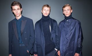 Three male models modelling Boss clothing in navy blue.