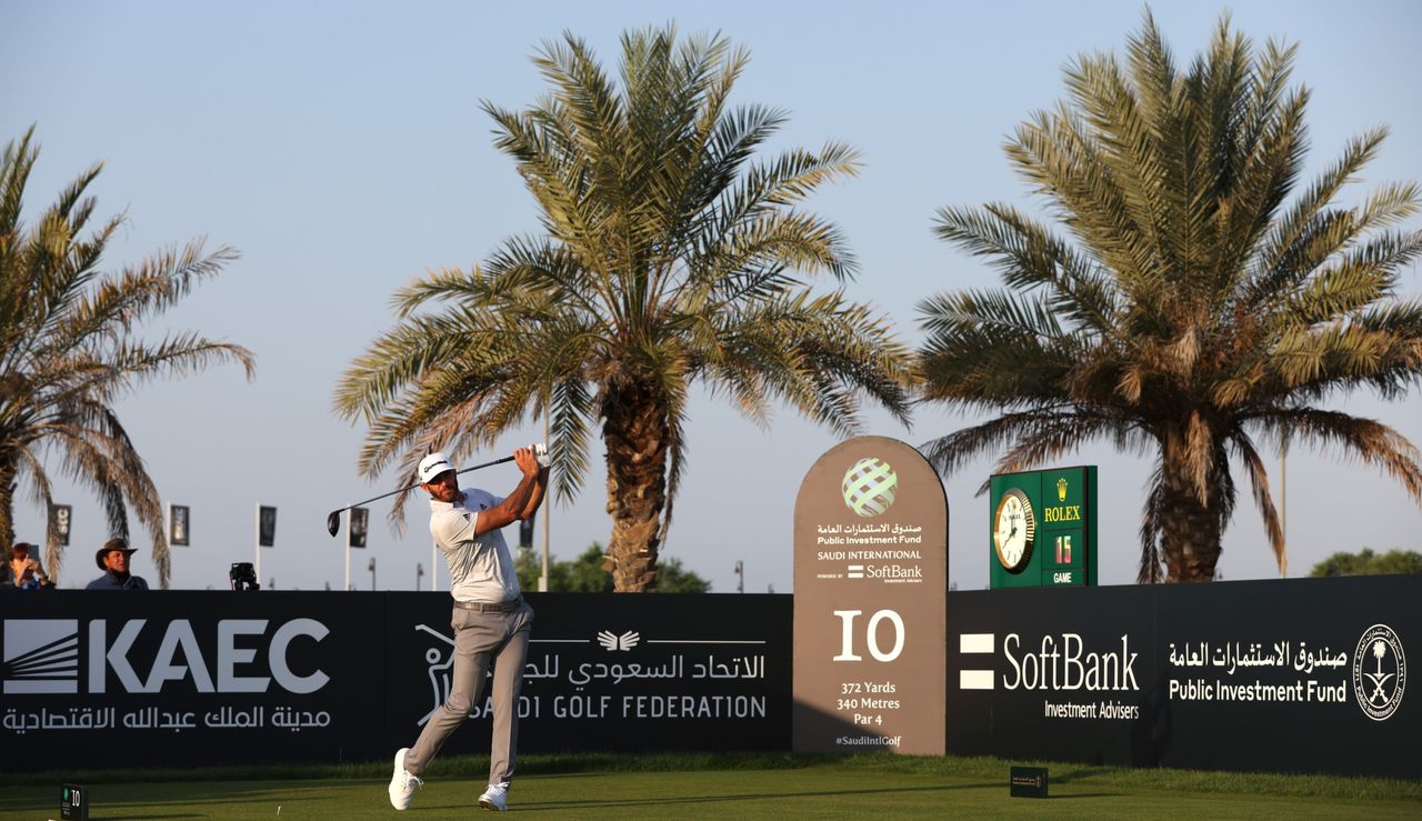 Johnson hits a tee shot