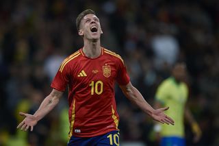 Dani Olmo celebrates after scoring for Spain in a friendly against Brazil in March 2024.