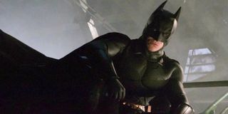 Christian Bale looks over Gotham in Batman Begins