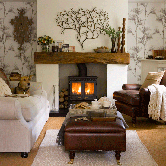 Wooden Mantelpiece above burning fireplace with dog lying on couch next to fire