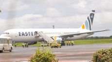 A plane carrying foreign nationals deported from the United States arrives in Liberia.