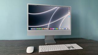 A photograph of the 24in 2021 Apple iMac on a table 
