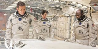 (L to R) Matthew McConaughey, Anne Hathaway and David Gyasi in space suits in Interstellar