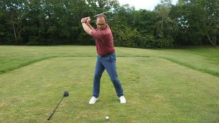 weight distribution at the top of the backswing