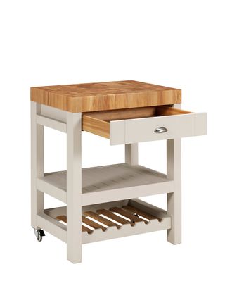 A butchers block with a drawer, white wooden legs and two open shelves