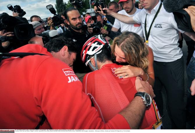 Tony Gallopin realises that he's moved into yellow with girlfriend Marion Rousse by his side