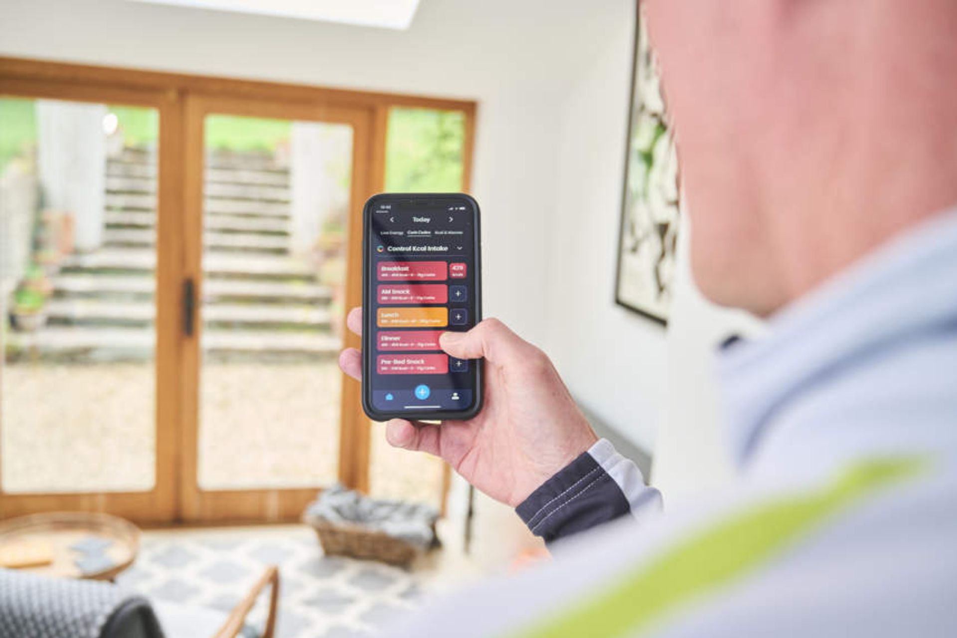 Male cyclist looking at a nutrition app