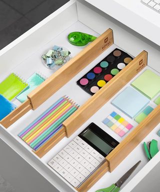 Drawer divider with office supplies