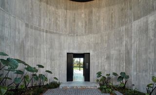 Concrete entrance wall and door
