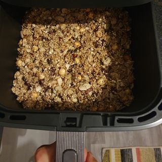 Granola in the open drawer of the COSORI Turbo Blaze air fryer