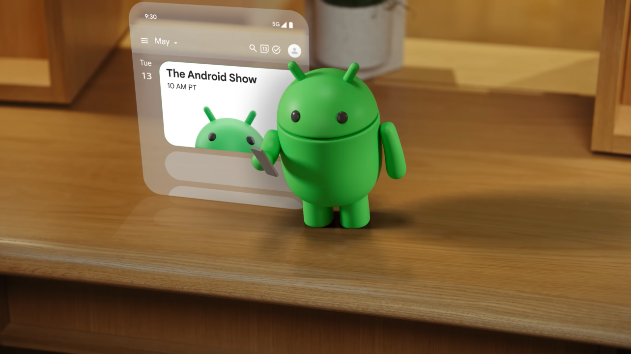 google android show mascot holding its phone and putting the show date into its calendar