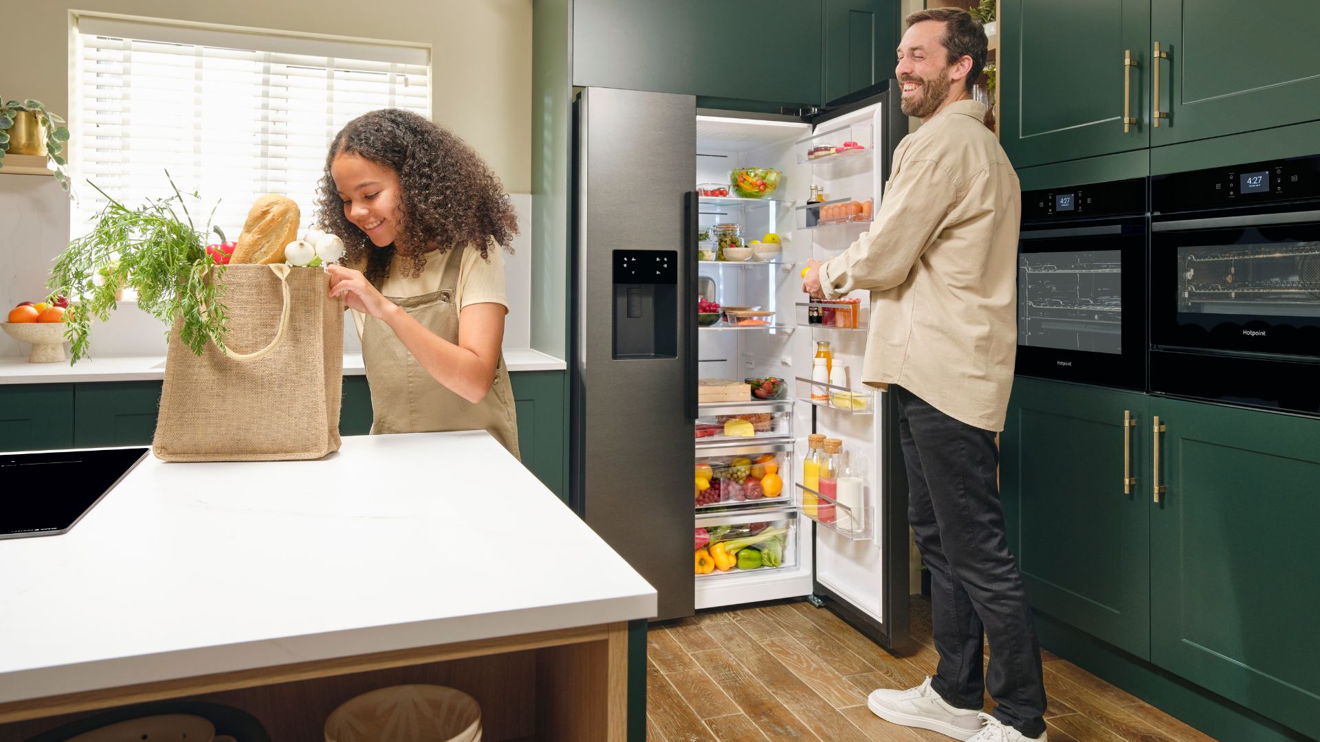The AO Hotpoint kitchen being used in a family setting