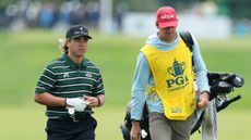 Garrick Higgo and his caddie walk along the fairway at the 2026 PGA Championship