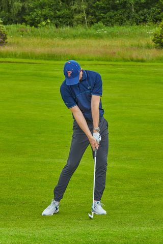 Ged Walters demonstrating impact position with an iron swing