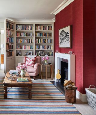 Dark crimson living room with monochromatic fireplace