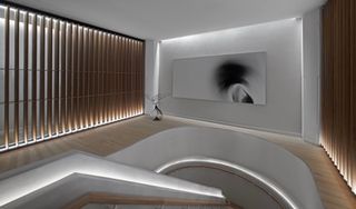 Stairs at Bian spa in Chicago with white walls and black and white picture