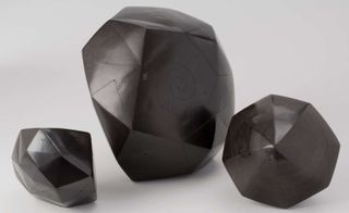 Image of 3 rock like sculpture in black
