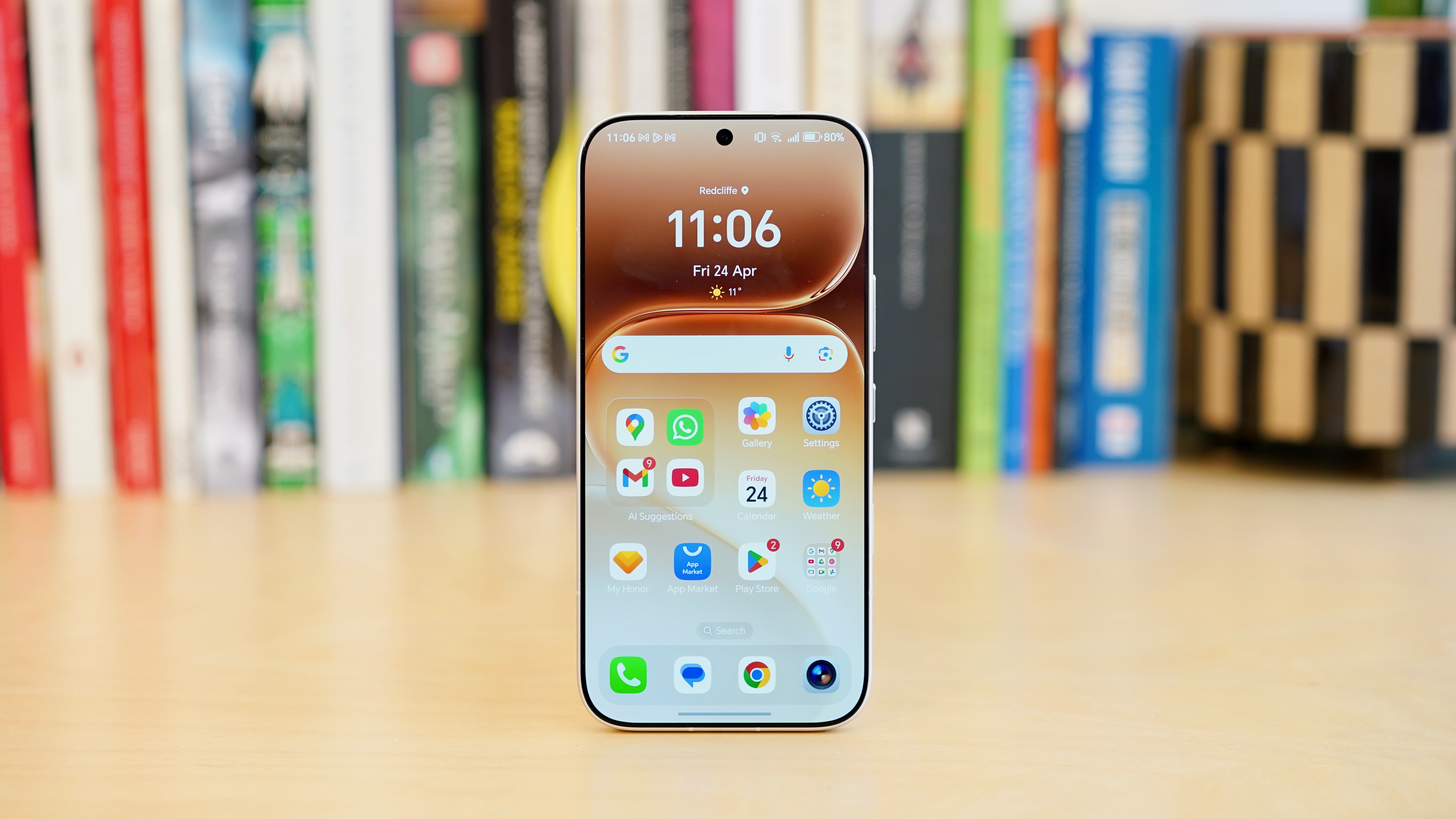 A white Honor 600 Pro resting on a wooden table