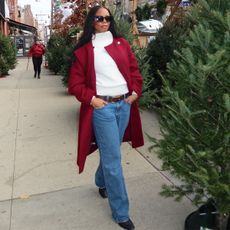 Sierra wears a red jacket, white sweater, abercrombie low rise baggy jeans and black flats.