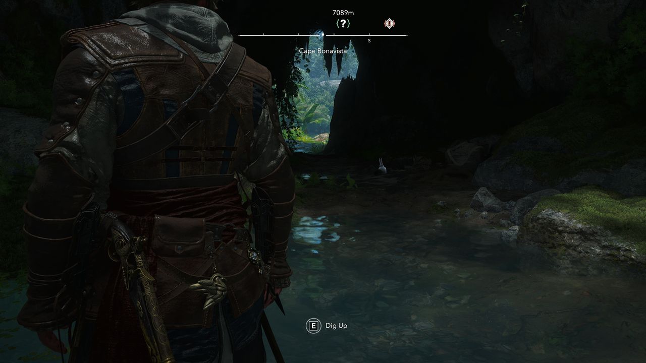 Black Flag treasure maps: Edward standing inside a dark cave looking out at the beach.