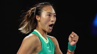 inwen Zheng of China, wearing a green vest, celebrates making it through to the Sabalenka vs Zheng Australian Open 2024 women's final