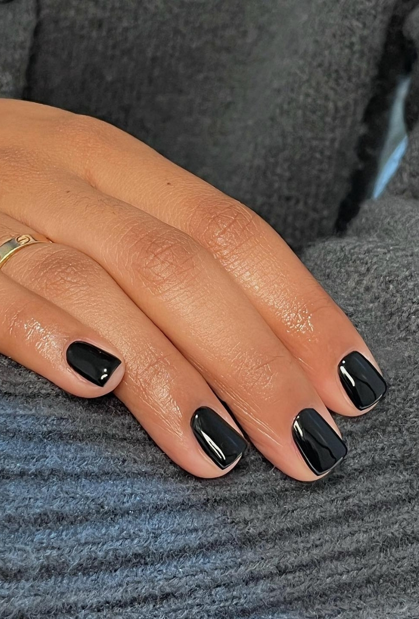 A close-up shot of jet black nails