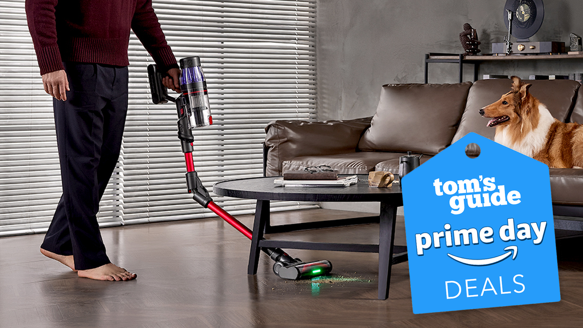 a cordless budget stick vacuum with a green laser eye cleans the floor in a house with a tom&#039;s guide prime day tag