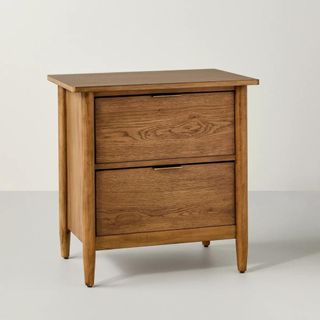 A two-tiered wooden nightstand