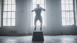 An athlete doing a box jump