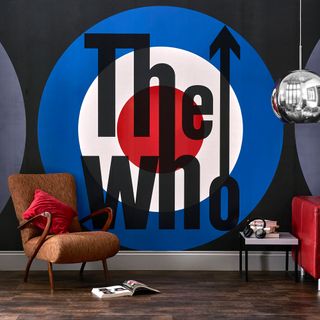 the who wallpaper with hanging light and armchair
