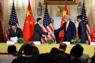 Secretary of State John Kerry shakes hands with Chinese Vice Premier Wang Yang at the conclusion of the U.S.-China Strategic and Economic Dialogue/Consultation on People-to-People Exchange at the U.S. Department of State in Washington, DC., on June 24, 2015.
