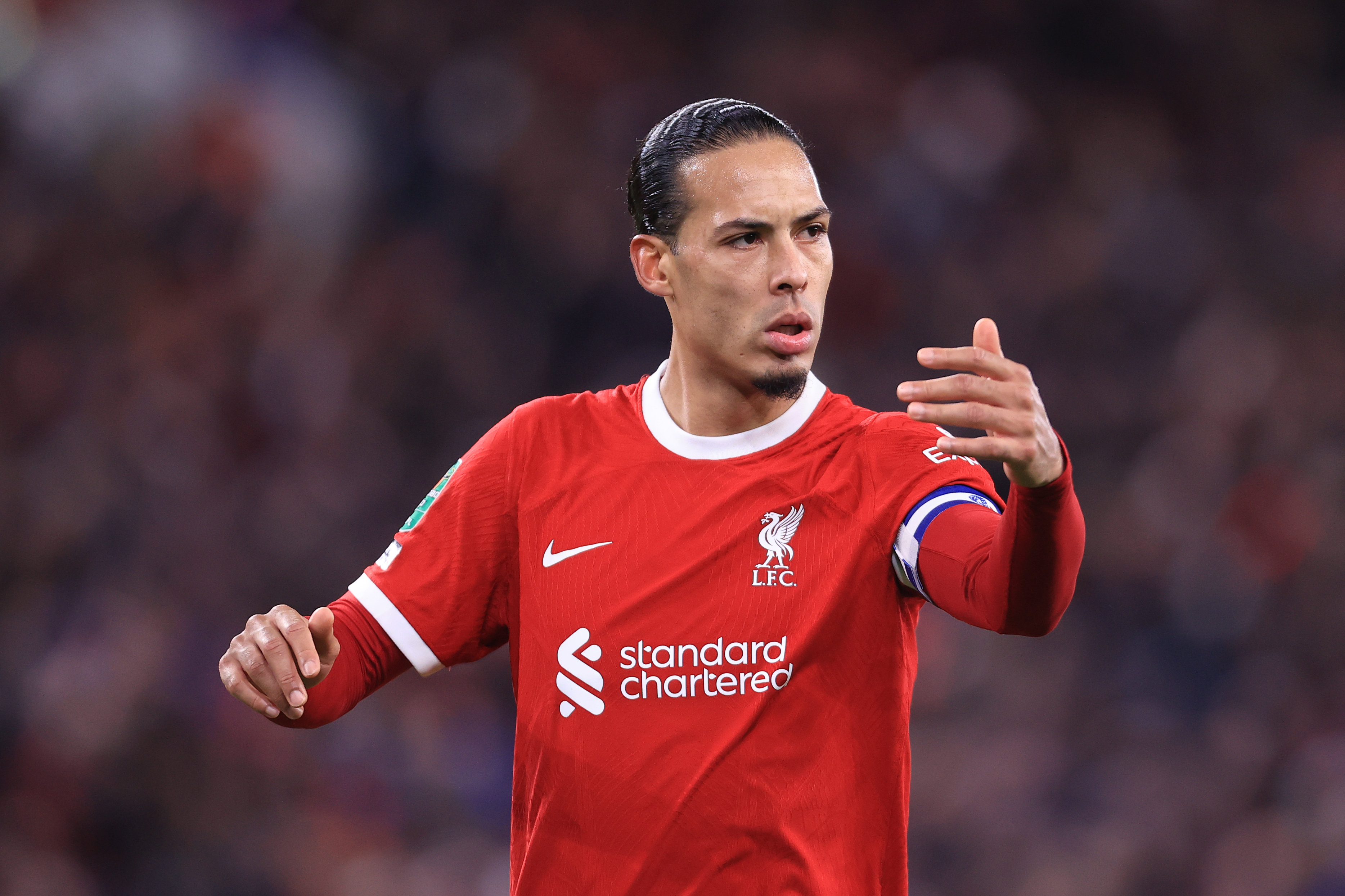 Virgil van Dijk of Liverpool gestures during the Carabao Cup Semi Final First Leg match between Liverpool and Fulham at Anfield on January 10, 2024 in Liverpool, England.