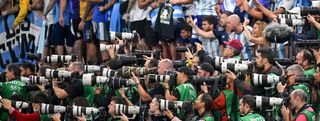Photographers take pictures of Argentina celebration after their team's 3-0 victory in during the FIFA World Cup Qatar 2022 semi final match between Argentina and Croatia at Lusail Stadium on December 13, 2022
