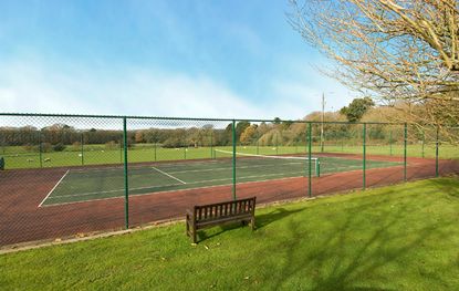 homes with tennis courts for sale