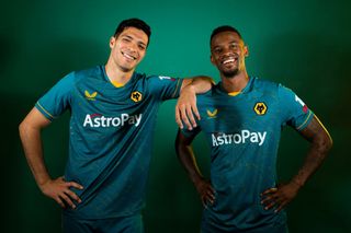 Raul Jimenez (L) and Nelson Semedo of Wolverhampton Wanderers pose for a portrait in the Wolverhampton Wanderers Season 2022/23 Away Kit at The Sir Jack Hayward Training Ground on July 08, 2022 in Wolverhampton, England.