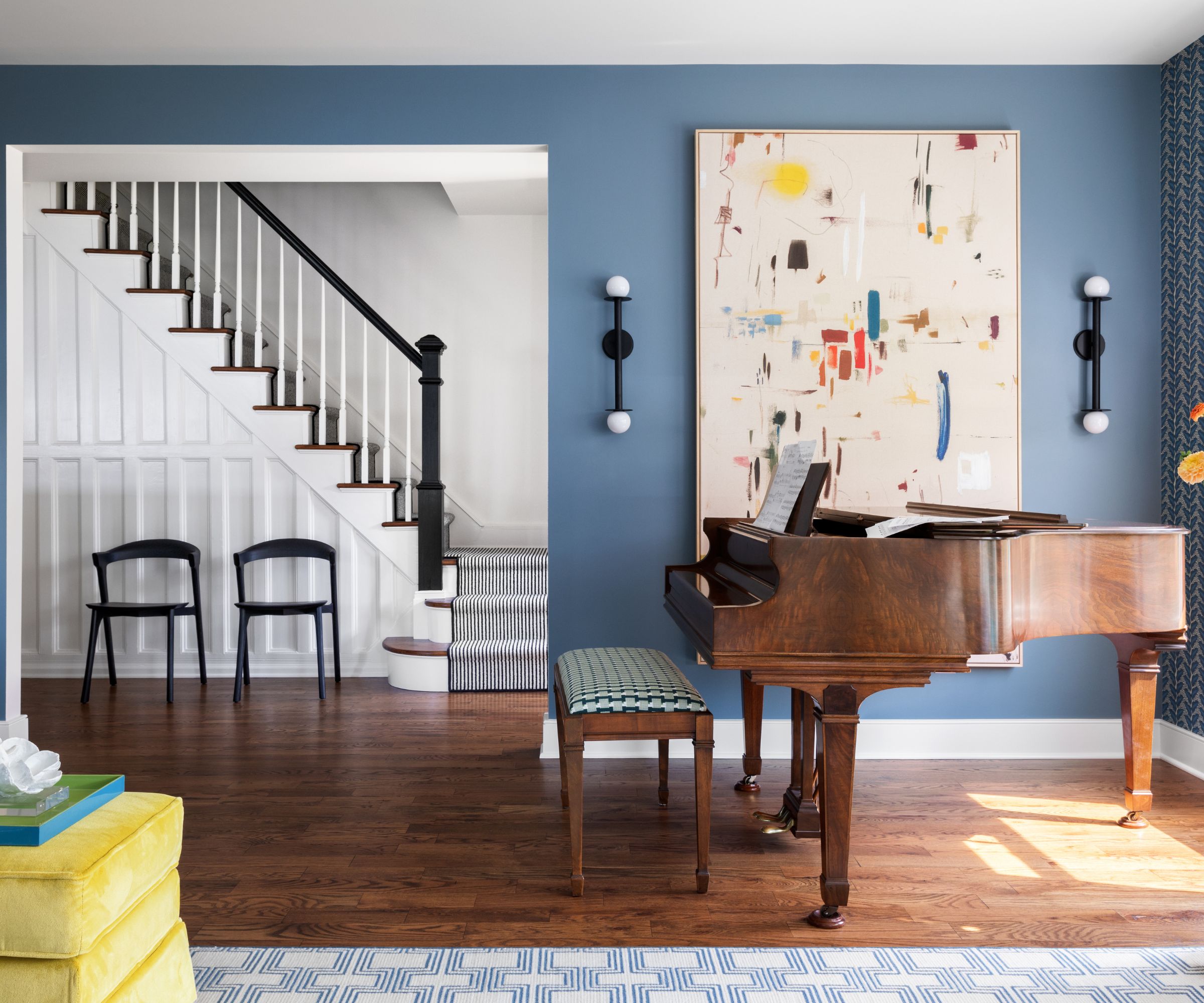 Pal blue living room with grand piano and large artwork